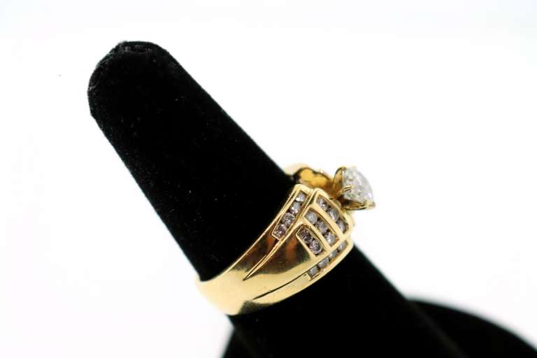 Gorgeous Centerpiece Diamond Ring with Channel Set Diamonds on a 18k Gold Band