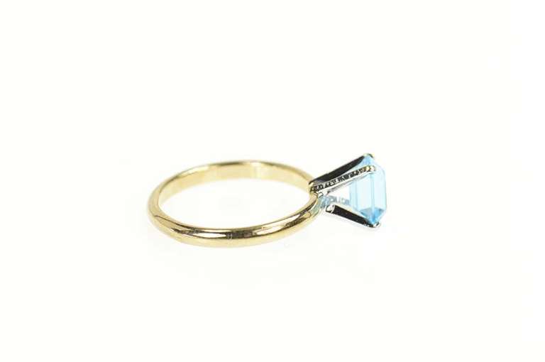 Gold Plated Sim. Emerald Cut Blue Topaz Solitaire Ring