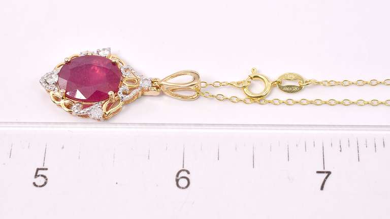 Incredible 0.19CTW Diamond and 5.08CTS Ruby Pendant Necklace in Gold Plated Sterling Silver