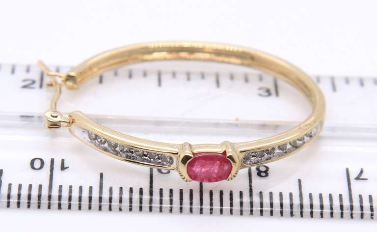 Charming Yellow Gold oval Ruby & Diamond Hoop Earrings