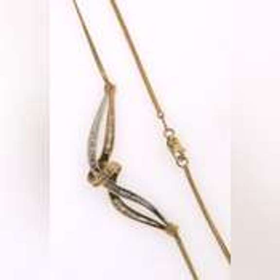 14k yellow gold necklace with two tone gold wrap around diamond pendant