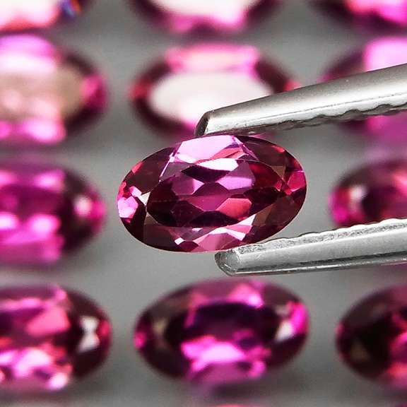 Ravishing 8.51ct violet pink Rhodolite Garnet set