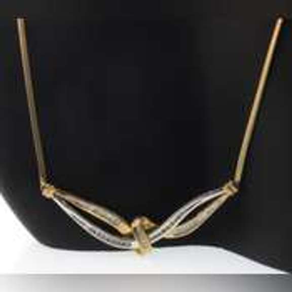 14k yellow gold necklace with two tone gold wrap around diamond pendant