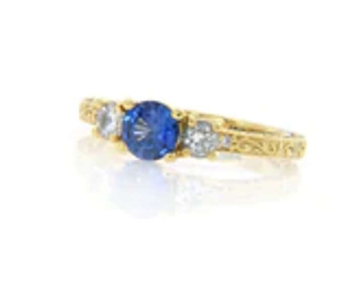 Shimmering 18kt Round Sapphire and Diamond Three Stone Ring