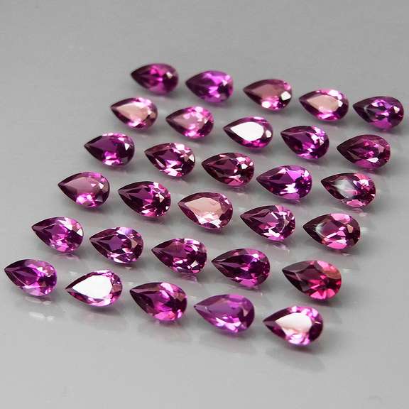 Ravishing 7.55ct violet pink Rhodolite Garnet set