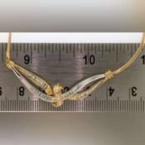 14k yellow gold necklace with two tone gold wrap around diamond pendant