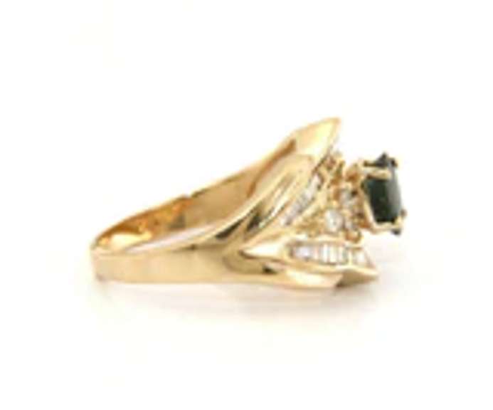 Handsome Yellow Gold oval Sapphire and Baguette Diamond Ring