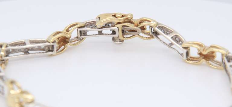 Handsome Two Tone Gold Diamond Tennis Bracelet Closed with a Push Button Tongue Style Box Clasp