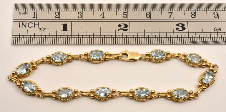Fashionable Gold & Blue Topaz Bracelet