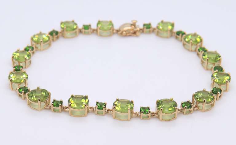 Powerful Yellow Gold Peridot and Tsavorite Bracelet