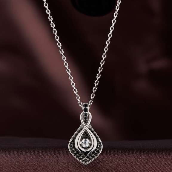 Infinity Nestled Cloud of Black Pavee Stones