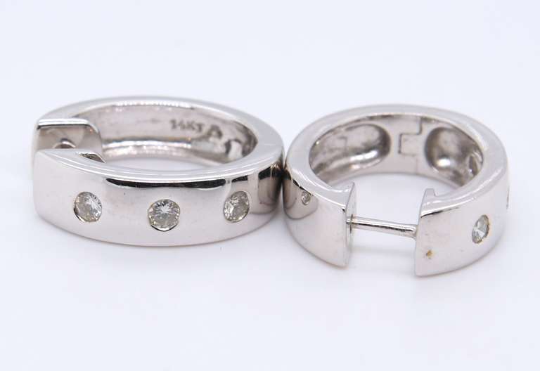 Attractive White Gold 3 Stone Diamond oval Huggies