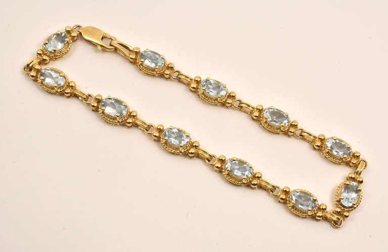 Fashionable Gold & Blue Topaz Bracelet