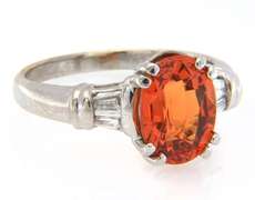 Fancy White Gold oval Orange Garnet and Baguette Diamond Ring