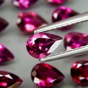 Premium pear cut 9.49ct VS Rhodolite Garnet set