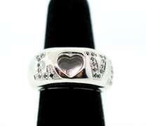 LADIES 18 KT WHITE GOLD DIAMOND 'LOVE' RING.