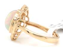 Incredible Yellow Gold opal Emerald and Diamond Frame Ring