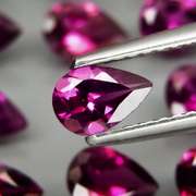 Premium pear cut 9.22ct VS Rhodolite Garnet set