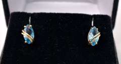 Tasteful Topaz Earrings in 14K Yellow Gold