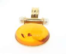 STUNNING AMBER SET IN 14KT YELLOW GOLD