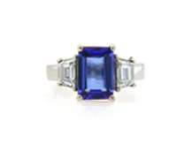 Quintessential Emerald Cut Tanzanite and Trapezoid Diamond Ring