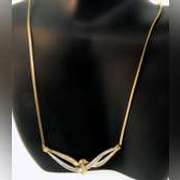 14k yellow gold necklace with two tone gold wrap around diamond pendant