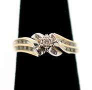 10k White and Yellow Gold Centerpiece Diamond Ring Flanked with Channel Set Diamonds