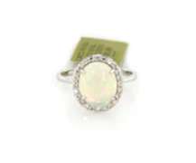 Attractive New oval Opal Cabochon and Diamond Ring