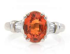 Fancy White Gold oval Orange Garnet and Baguette Diamond Ring