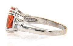 Fancy White Gold oval Orange Garnet and Baguette Diamond Ring