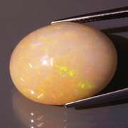 Smoldering flashing 12.07ct bi-colored Opal