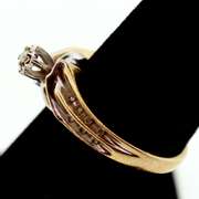 10k White and Yellow Gold Centerpiece Diamond Ring Flanked with Channel Set Diamonds