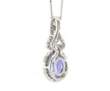 Romantic White Gold oval Tanzanite and Diamond Pendant