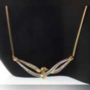 14k yellow gold necklace with two tone gold wrap around diamond pendant