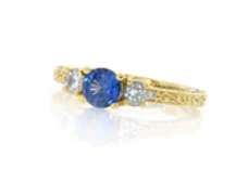 Shimmering 18kt Round Sapphire and Diamond Three Stone Ring