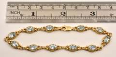 Fashionable Gold & Blue Topaz Bracelet