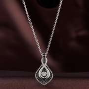 Infinity Nestled Cloud of Black Pavee Stones