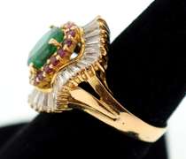 18k yellow gold ladies emerald rubies and diamond ballerina ring.
