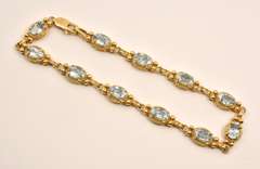 Fashionable Gold & Blue Topaz Bracelet