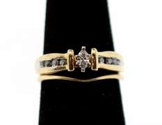 Shiny 10k Gold Oval Diamond Ring Flanked with Baguette Diamonds