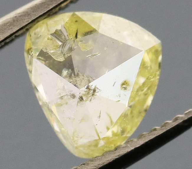 Amazing .60ct pear cut canary yellow Diamond