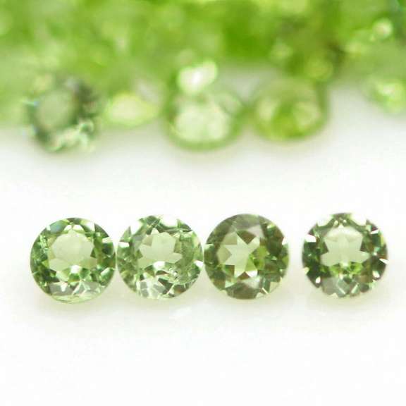 Fantastic 12.20ct round brilliant cut Peridot set