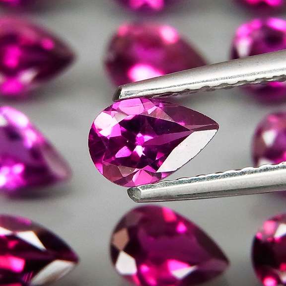 Ravishing 8.99ct violet pink Rhodolite Garnet set