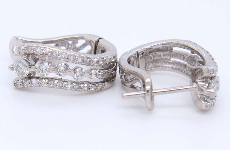 Dazzling White Gold Triple Wave Diamond Huggie Earrings