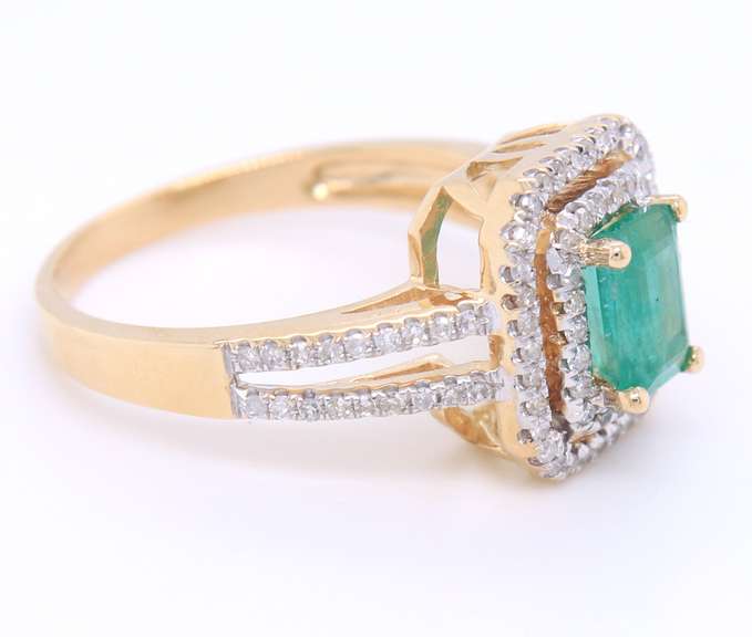 Attractive Emerald Cut Emerald in Double Halo Diamond Setting