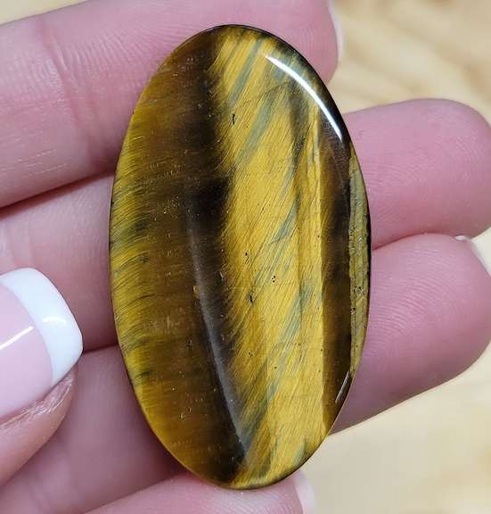 Unique! 42.81ct Golden Tiger Eye cabochon