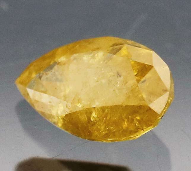 Rare .39ct pear cut yellow Diamond