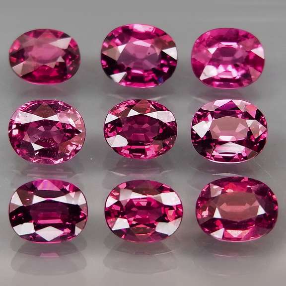Amazing 5.63ct oval cut violet red Garnet set