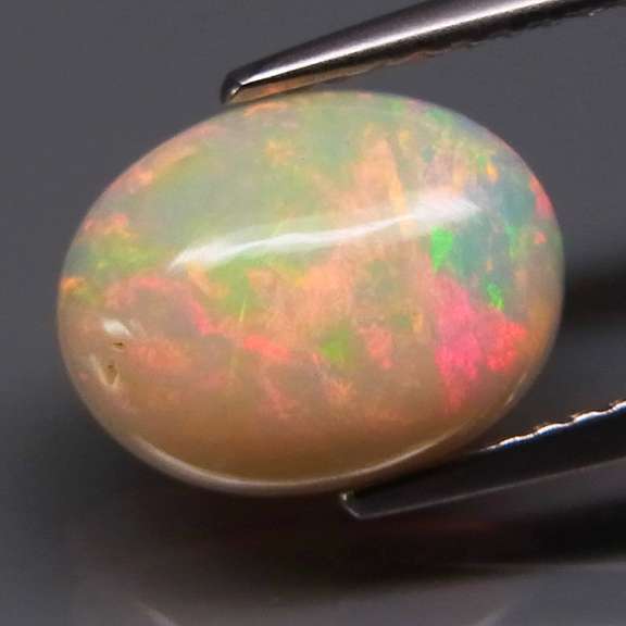 2ct floral flashing semi-black Ethiopian Opal