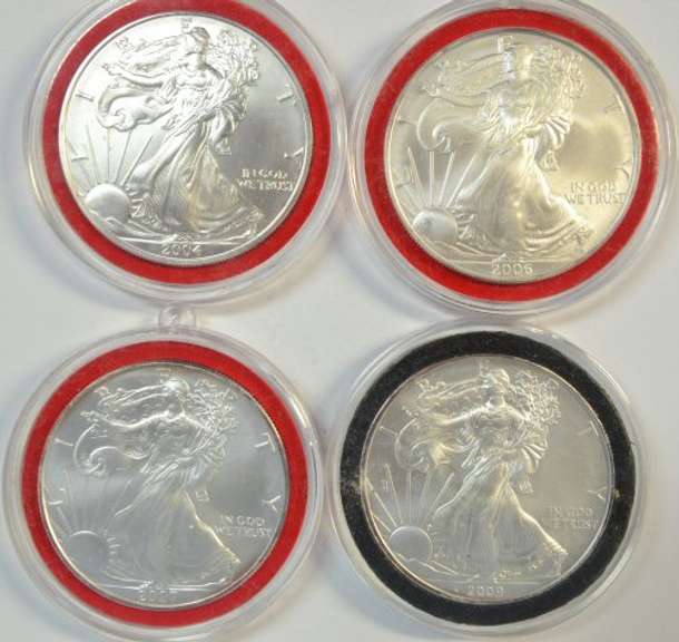 4 Diff. Superb Gem BU $1 Silver Eagles in custom capsules